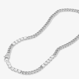 Detail of silver Cuban link necklace featuring a sparkling crystal tennis chain segment