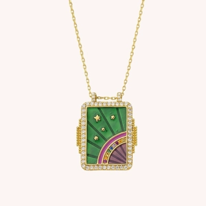 Detail of gold rectangular tarot necklace with green enamel, star relief and zircon border