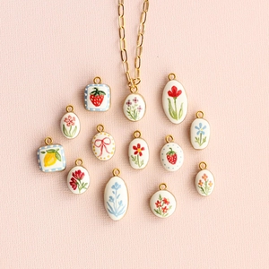 Floral fruit pendant necklace set with strawberry lemon and bow charms on gold chain