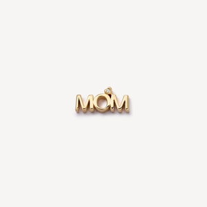 Close-up of a 18k gold MOM locket pendant featuring a small sparkling white gemstone