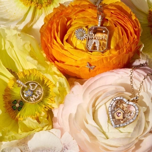 Vintage 18k gold floating locket pendants with Mama lettering and floral decor