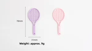 Macro detail of mini tennis racket charms with dimensions 78mm by 31mm for DIY jewelry