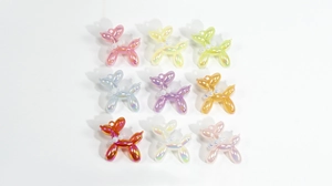 Detailed set of 9 colorful balloon dog charms with pearl collars and iridescent finish