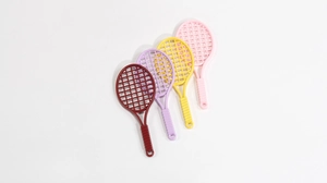 Mini plastic tennis racket charms in red, purple, yellow, and pink colors for DIY