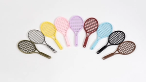 Detail showing colorful mini tennis racket pendants in nine shades for DIY crafts