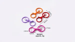 Detailed view of colorful matte alloy lobster clasps and round spring rings for DIY keychains