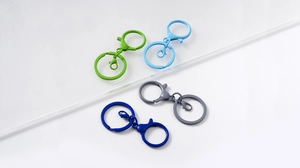 Detail of colorful alloy lobster clasps and flat split rings in varied paint finishes
