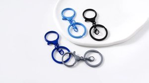 Close-up of matte lacquer lobster claws and metal key ring DIY jewelry components