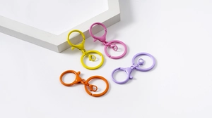 Close-up of colorful alloy spring ring and lobster clasp DIY keychain hardware set