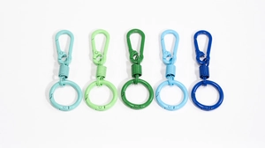 Close-up of matte macaron spring U-shaped keychains in blue and green gradients