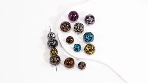 Detailed macro view of leopard print acrylic round beads for DIY jewelry and accessories