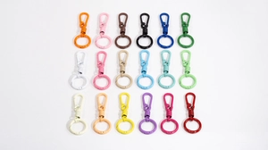 Macro display of 18 colorful macaron-style spring lobster clasps for DIY accessories