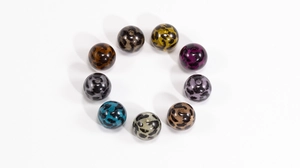 Macro view of assorted leopard print acrylic round beads with holes for DIY jewelry making