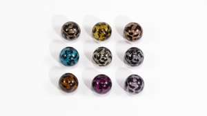 Detailed grid of assorted leopard print acrylic round beads for DIY jewelry making