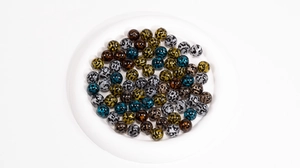 Macro shot of assorted leopard print acrylic beads for DIY jewelry and accessories