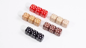 Macro detail of acrylic cube beads with polka dot patterns for DIY jewelry making