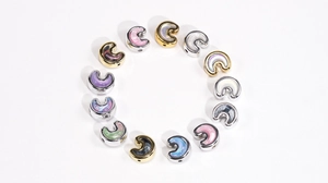 Macro view of colorful oil painting style beads for DIY jewelry and phone chains