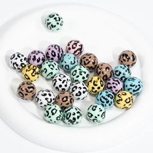 Colorful acrylic leopard print beads in various shades for DIY jewelry making and crafts