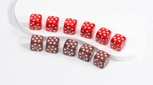 Close-up of cube acrylic beads with polka dots in red and brown for DIY jewelry making