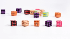 Macro detail of argyle pattern cube beads with center holes for DIY jewelry making