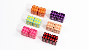 Macro shot of colorful argyle patterned cube beads for DIY jewelry and crafts