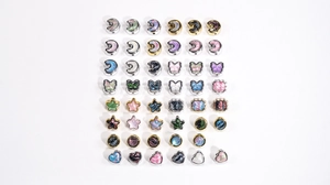Detailed grid of moon, butterfly and star oil painting style charm beads for DIY jewelry
