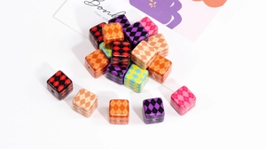 Macro shot of argyle pattern acrylic cube beads for DIY jewelry and phone chains