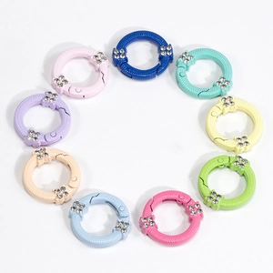 Anelli a molla rotondi colorati con strass in dieci varie tonalità pastello
