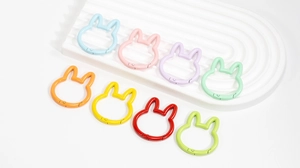 Detail of bunny-shaped metal spring buckles in 8 pastel colors for DIY crafts