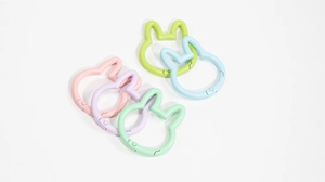 Macro view of colorful rabbit-shaped spring buckles in macaron colors for DIY keychains