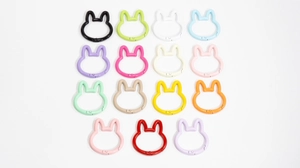 Matrix of fifteen colorful rabbit-shaped spring buckles for DIY bag accessories