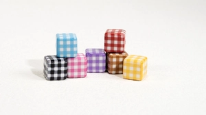Macro shot of colorful plaid acrylic square beads for DIY jewelry and crafts making
