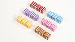 Macro shot of colorful checkered acrylic cube beads for DIY keychains and jewelry making