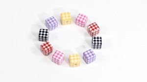 Macro shot of colorful checkered acrylic cube beads for DIY jewelry and phone chains