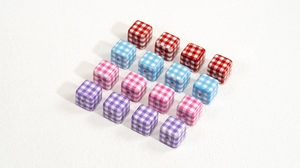 Macro detail of acrylic Gingham print square beads for DIY jewelry and phone chain making
