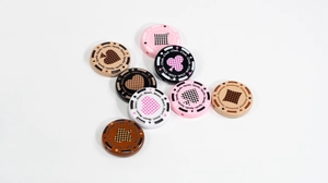 Macro view of poker chip silicone beads with spade heart patterns for DIY jewelry
