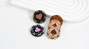 Detailed view of round poker-themed DIY beads featuring heart, club, spade, and diamond patterns