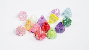 Detailed view of colorful iridescent lotus pod and flower bud acrylic DIY charms