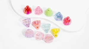 Macro shot of colorful pearlescent lotus seed pod pendants for DIY jewelry making