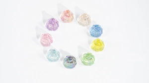 Detailed view of ten colorful aurora resin lotus pendants in a circular arrangement
