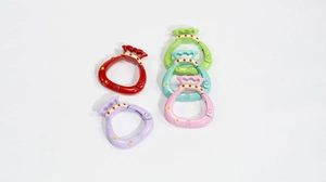 Set of five colorful lucky bag spring ring clasps with engraved character and stars