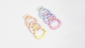 Macro view of colorful lucky bag spring ring clasps with embossed Chinese fortune characters