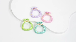 Macro detail of macaron-colored lucky bag spring rings with embossed character