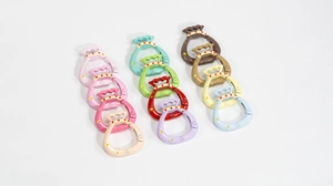Macro detail of fortune bag round spring rings with Fu character in various colors