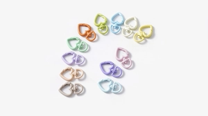 Colorful heart-shaped spring ring keychains in a variety of pastel macaron paint finishes