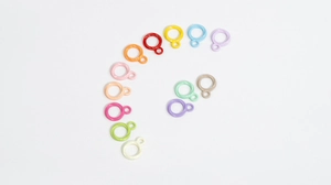 Macro shot of colorful twist round rings in 13 shades for DIY jewelry making