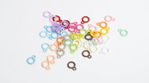 Close-up of colorful twisted rope rings for DIY crafts and keychain accessories