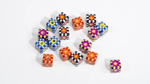 Detailed view of colorful checkerboard beads with flower patterns for DIY jewelry making
