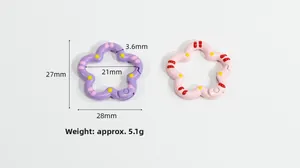 Detailed view of flower-shaped alloy spring ring with dots for DIY keychains