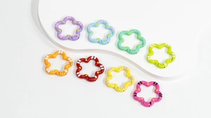 Macro view of colorful floral alloy spring rings for DIY keychain and bag accessories